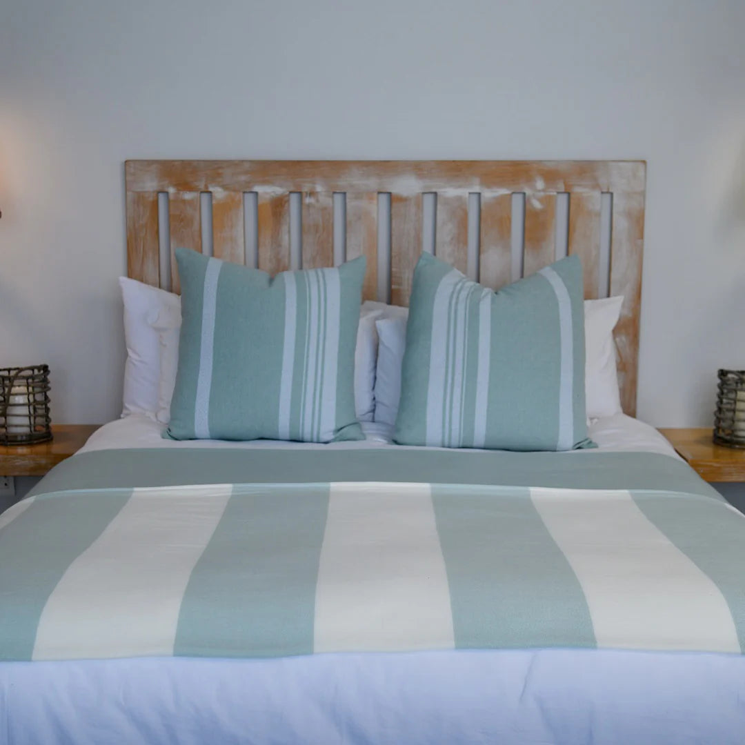 A Melody Mariner throw, elegantly spread across a neatly made bed, showcasing its soft texture and nautical-inspired design. Ideal for creating a cozy, sophisticated ambiance in any lodge or guesthouse. #LodgeLuxury #HotelComfort #PremiumBlankets #GuestSatisfaction #HospitalityExcellence