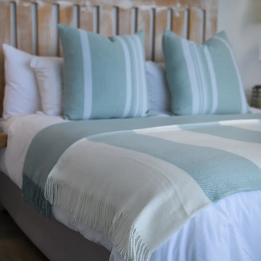 A Melody Mariner throw, elegantly spread across a neatly made bed, showcasing its soft texture and nautical-inspired design. Ideal for creating a cozy, sophisticated ambiance in any lodge or guesthouse. #LodgeLuxury #HotelComfort #PremiumBlankets #GuestSatisfaction #HospitalityExcellence