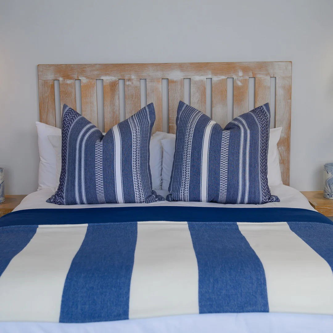 A Melody Mariner throw, elegantly spread across a neatly made bed, showcasing its soft texture and nautical-inspired design. Ideal for creating a cozy, sophisticated ambiance in any lodge or guesthouse. #LodgeLuxury #HotelComfort #PremiumBlankets #GuestSatisfaction #HospitalityExcellence