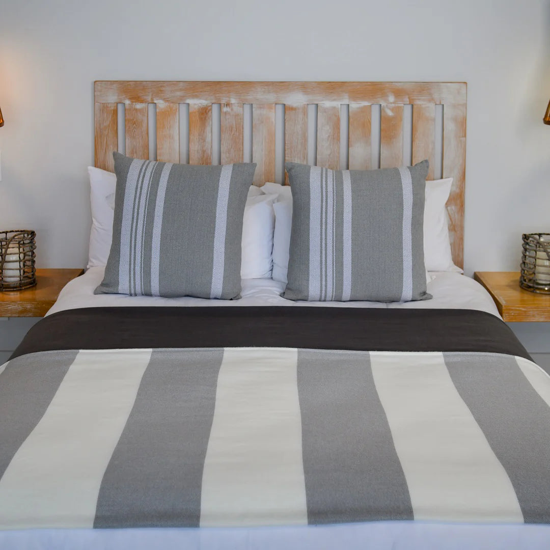 A Melody Mariner throw, elegantly spread across a neatly made bed, showcasing its soft texture and nautical-inspired design. Ideal for creating a cozy, sophisticated ambiance in any lodge or guesthouse. #LodgeLuxury #HotelComfort #PremiumBlankets #GuestSatisfaction #HospitalityExcellence*