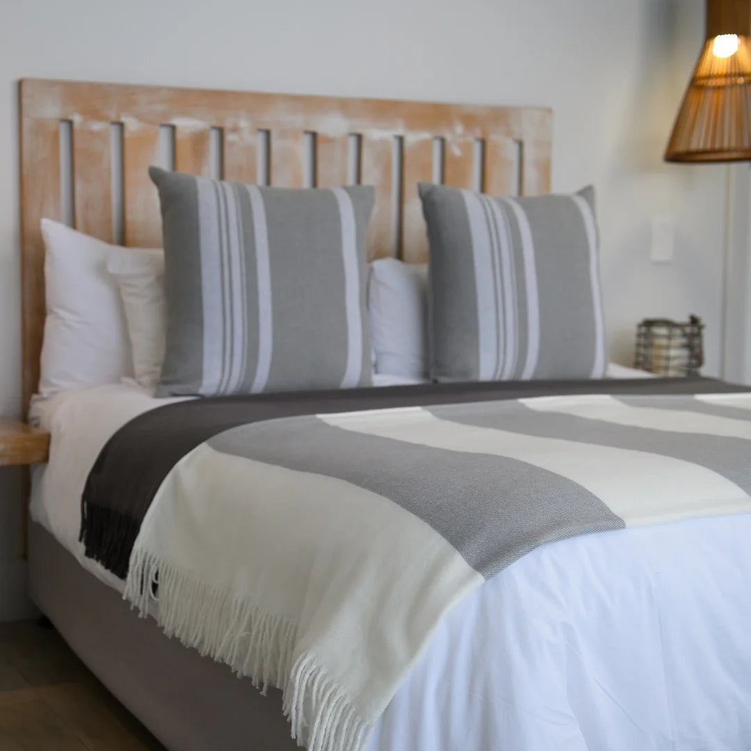 A Melody Mariner throw, elegantly spread across a neatly made bed, showcasing its soft texture and nautical-inspired design. Ideal for creating a cozy, sophisticated ambiance in any lodge or guesthouse. #LodgeLuxury #HotelComfort #PremiumBlankets #GuestSatisfaction #HospitalityExcellence